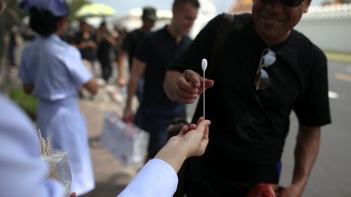 For Thais overcome by the king`s death, medics and a hotline